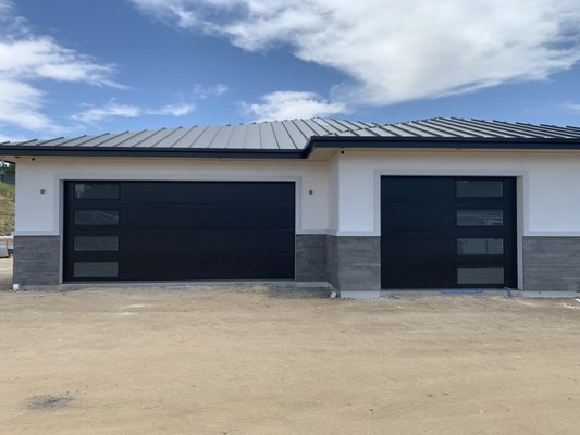 Modern Black Doors with Frosted Windows - These are sleek modern black doors with frosted windows. The offset windows bring balance to such big garage doors and make a statement of this beautiful home! Modern Black Doors with Frosted Windows - These are sleek modern black doors with frosted windows. The offset windows bring balance to such big garage doors and make a statement of this beautiful home!