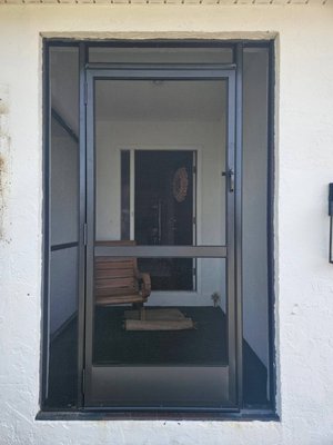 Door & Frame Replacement on Existing Screen Enclosure - This enclosure had older hurricane-related damage that had never been repaired. The structure itself was still in good condition, so we replaced just the door and frame to restore proper function and appearance without requiring a full rebuild. Door & Frame Replacement on Existing Screen Enclosure - This enclosure had older hurricane-related damage that had never been repaired. The structure itself was still in good condition, so we replaced just the door and frame to restore proper function and appearance without requiring a full rebuild.