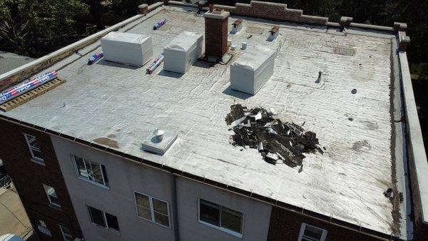 Flat Roof TPO Replacement - The client had roof leaks throughout and the age of his roof was showing signs of defeat. We tore off the modified bitumen and gravel layers which was quite some work, 3 layers in total. We got to the deck and installed polyiso insulation and a mechanically fastened TPO roofing membrane which I recommend as the best flat roofing product today. We also installed a new 6" galvanized gutter and added a downspout. Flat Roof TPO Replacement - The client had roof leaks throughout and the age of his roof was showing signs of defeat. We tore off the modified bitumen and gravel layers which was quite some work, 3 layers in total. We got to the deck and installed polyiso insulation and a mechanically fastened TPO roofing membrane which I recommend as the best flat roofing product today. We also installed a new 6" galvanized gutter and added a downspout.