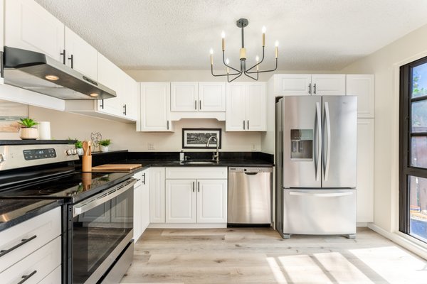 MAKAKILO DRIVE - Sleek white cabinets on Makakilo Drive bring a fresh, timeless style to the kitchen, creating a bright and inviting space MAKAKILO DRIVE - Sleek white cabinets on Makakilo Drive bring a fresh, timeless style to the kitchen, creating a bright and inviting space