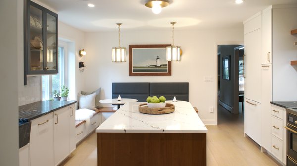 Modern Bistro Kitchen Remodel - Monk’s transformed a monochrome kitchen into a warm, modern space with a cozy eat-in nook. The mix of wood, countertop surfaces, and cabinet door colors make the newly remodeled kitchen visually interesting. Modern Bistro Kitchen Remodel - Monk’s transformed a monochrome kitchen into a warm, modern space with a cozy eat-in nook. The mix of wood, countertop surfaces, and cabinet door colors make the newly remodeled kitchen visually interesting.
