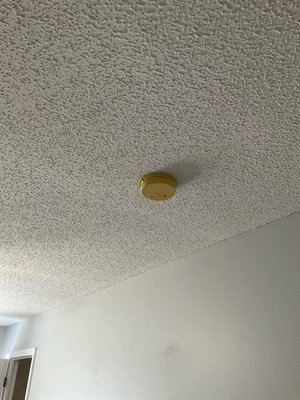 Smoke detector - Manufacturers often add a fire retardant called bromine to the plastic of smoke detectors, which can cause them to yellow over time. This is a deliberate design feature to indicate that the detector is old and should be replaced.

They also lose sensitivity overtime. Rule of thumb, if you’re buying a new home, always replace the smoke detectors. 💪🏼