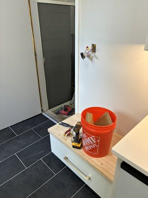Laundry Room - Helped finish a laundry room remodel installing the customer purchased cabinets and tile.
