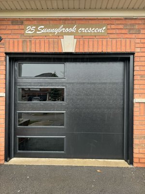 Garage Door Installation - Modern Garage Door Installation in Etobicoke.
Overhead Residential Garage Door with windows on top. Garage Door Installation - Modern Garage Door Installation in Etobicoke.
Overhead Residential Garage Door with windows on top.