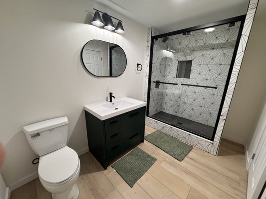 Finished Basement Remodel - We added a bedroom, a full bathroom, and a spacious entertainment area, turning this previously unfinished space into 1,000 sq ft of functional living space. Now the homeowners have a perfect blend of comfort and versatility right below their feet.