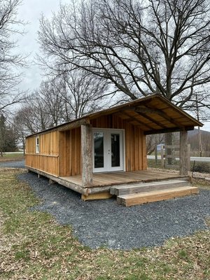 Tappan Zee reclaimed Lumber "NOTASHED" - Apex Modular Solutions holds the sole rights to manufacture and distribute the reclaimed logs from the Historic Tappan Zee Bridge. Using this unique material, we have developed a product line called NOTASHED, which comprises Party Barns, Cottages, and Starter Mini Homes that can be conveniently assembled through DIY projects. These structures are completed on the exterior and partly finished on the interior. Additionally, we craft outdoor park furniture and interior accent pieces like fireplace mantels and decorative beams from the same logs. Tappan Zee reclaimed Lumber "NOTASHED" - Apex Modular Solutions holds the sole rights to manufacture and distribute the reclaimed logs from the Historic Tappan Zee Bridge. Using this unique material, we have developed a product line called NOTASHED, which comprises Party Barns, Cottages, and Starter Mini Homes that can be conveniently assembled through DIY projects. These structures are completed on the exterior and partly finished on the interior. Additionally, we craft outdoor park furniture and interior accent pieces like fireplace mantels and decorative beams from the same logs.