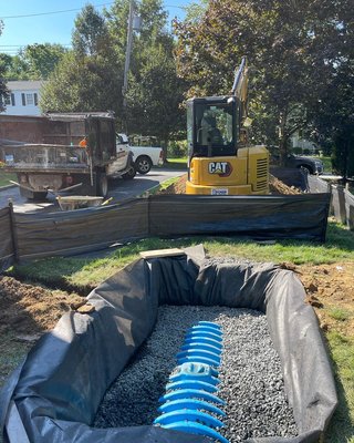 Trench drain installation - Installation of interior trench drain connected to exterior drywell system