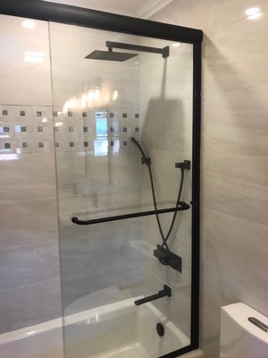 Bathroom Remodel - Shower/Tub Conversion - This bathroom previously had only a shower but the client wanted a bathtub and shower combo. We upgraded the plumbing, prepared new custom tile work in the entire bathroom. We upgraded the vanity to a modern floating double vanity. Bathroom Remodel - Shower/Tub Conversion - This bathroom previously had only a shower but the client wanted a bathtub and shower combo. We upgraded the plumbing, prepared new custom tile work in the entire bathroom. We upgraded the vanity to a modern floating double vanity.