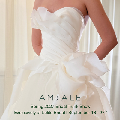 Amsale Spring 2027 - Amsale design house stays true to the original vision of its namesake. Minimalist, Classic Silhouettes with modern twists.  A level of sophistication and romance, chic and architectural, clean lines, and soft draping. 
With this collection you will see the juxtaposition of soft and structure. Sculptured bodices, voluminous skirts of chiffon and duchess satin. With feminine details like florals, lace, and bows. Amsale is known for their couture craftsmanship and construction. Schedule your appointment to explore the beauty of the newest collection.