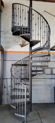 Spiral Staircase - Family owned iron working and forging. Decorative balconies, stair case railings, doors, fences and gates.