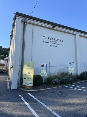 Testarossa winery in Los Gatos removal - The removal of the dead oak near the patio courtyard was a precise and strategic process, requiring careful rigging to safely lower the tree and avoid damage to the surrounding property, fence, and patio tent. The client requested that a 10-foot section of the trunk be left standing to hang a winery sign and decorate with patio lights. Testarossa winery in Los Gatos removal - The removal of the dead oak near the patio courtyard was a precise and strategic process, requiring careful rigging to safely lower the tree and avoid damage to the surrounding property, fence, and patio tent. The client requested that a 10-foot section of the trunk be left standing to hang a winery sign and decorate with patio lights.
