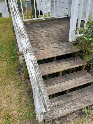 Power washing a deck covered in mold and mildew. - Refinishing a deck Power washing a deck covered in mold and mildew. - Refinishing a deck