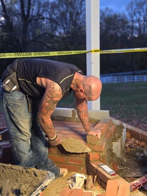 Outdoor Kitchen - We built an outdoor kitchen with 2 fridges, trash cans, papertowel holder, grill, pizza oven, flat top grill, and smoker.