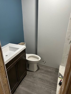 Bathroom Remodel - This is a basement  bathroom where I had to flip the laundry room and bathroom and add a shower. I also made the shower into a steam shower which is the digital display in the shower. In this project I busted up the concrete and rerouted all the plumbing and built the walls.