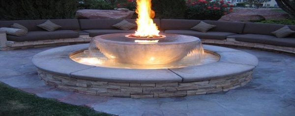 12 Fire pit designs for your backyard - In all honesty, we haven’t built a nice variety of fire pit designs in our areas of service. Most people want to go with the classic round fire pit, and very few of them chose to have benches built for their backyards, so that doesn’t give a nice variety of fire pit designs for our album.

However, I wanted to show you different firepit designs, so you get more ideas of what a fire pit could be. If you’re following us on social media (Facebook, Twitter, Google+ etc.) you’ve probably watched some of this pictures. Here are some great fire pit designs for your backyard:

Here’s a round design built with stone and the cover is made with flagstone. Plus you can see the small, round patio built with pavers, and the fire pit benches are also made with stone and flagstone.

This is a small, cozy design for people with little backyard space. It’s made with concrete and includes the small fire pit and concrete benches.

This is a square fire pit made with artificial stone (veneer), and it’s a little small, so I think this is perfect for small backyards.

I love this design because it’s very natural looking! The patio was built with flagstone and looks like the fire pit was built with natural stone around and a flagstone top. The fire pit benches are big natural stones, and I think that’s what makes this design very appealing!

Now, this is a more elegant design. As you can see, the fire pit is also a fountain built with stone (possibly veneer) and flagstone. The fire pit is built with concrete, but it’s very tiny. The fire pit benches are built with stone veneer, but they managed to accessorize them with cushions to make them more comfy.

This is a very simple and rough patio design made with flagstone, and the fire pit is an inground model (I’m planning to talk about that in a few more articles). The fire pit bench is made with flagstone on the top and its built with bricks.

This project was built in a ranch with a big space as you can see, but they decided to build a small patio and fire pit area. The patio was built with pavers and the fire pit and benches was built with bricks and a flagstone top.

I loved this design, people say a fire pit isn’t romantic, but check this design built with pavers and cobblestone blocks, the fire pit surrounding area is very elegant and you can use it as bench, plus the pillars add a very majestic finish. This is definitely one of my favorite fire pit designs!

This next design is for a small backyard as you can see. This is the classic round fire pit build with bricks (or cobblestone pavers, and the benches are also built with the same material.

The last fire pit design shows a patio built with pavers and a wall built with rustic blocks and a flagstone top. The design is simple, but because of the materials it looks very elegant!

I hope this was really helpful for you. Make sure to come back for more information and please, feel free to share this article with your friends!

If you want to install pavers, install stone or a fire pit in Northern California give us a call. Remember that we’re also available for your masonry needs!