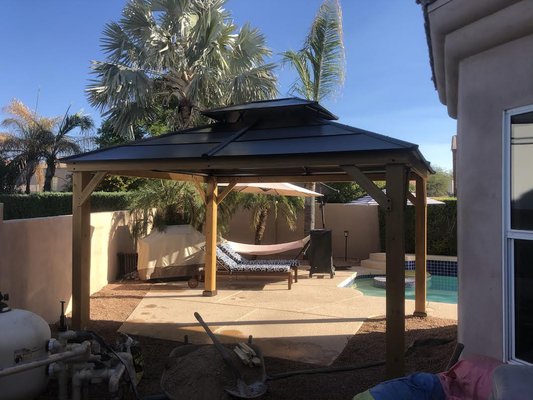 Pergola Build - The Home Owner purchased a "Pergola" from Amazon and asked if we would pour the concrete footings and install the Pergola. We had to be precise since the Pergola was going to be very close to the house. The project turned out great and the home owner was very happy. Pergola Build - The Home Owner purchased a "Pergola" from Amazon and asked if we would pour the concrete footings and install the Pergola. We had to be precise since the Pergola was going to be very close to the house. The project turned out great and the home owner was very happy.