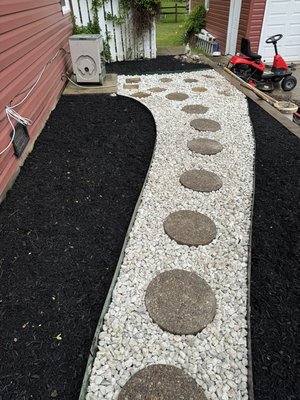Marble rock/mulch job - This project was unique as we used different materials to get the “WOW” effect Marble rock/mulch job - This project was unique as we used different materials to get the “WOW” effect