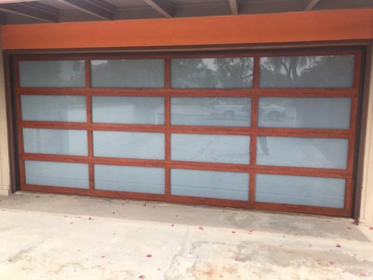 Full-view, wood-like Garage Door - Modern & stylish, full-view aluminum garage door in Cedar with frosted glass. The wood-like frame is extremely durable and low maintenance. Unlike real wood, it does not require any staining or upkeep.