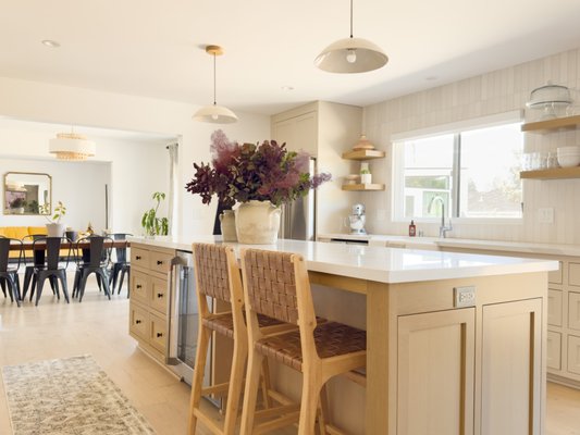 Kitchen Remodel - Dark cabinets. Carpet on the kitchen floor. Untouched for 40+ years. Walls came down. Light came in. Custom cabinetry, quartz countertops, and stacked porcelain tile on the range hood — every detail designed to make this kitchen feel warm, bright, and finally livable. ARCH Interior Design — Bay Area.