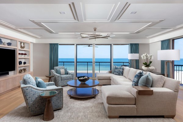 Casual - This stunning waterfront condo in Marco Island was fully remodeled. Creating a family friendly environment with a transitional design that touches on traditional comforts with the use of brick, warm woods and