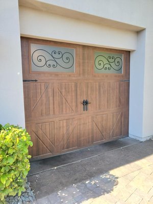 Amarr Classica CL 3000 Fix in Henderson NV - Our customer called and said "My garage door is literally falling apart!" and they weren't lying! Luckily our awesome tech, Robert, new exactly how to get this beautiful Amarr Classica CL 3000 (with frosted windows and Trellis accents) back up and running in no time.