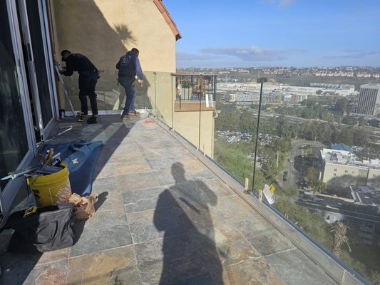 Patio remodeling - After the home owners moved to there new house they realize that the deck/ patio outside is about to break and its very danger, We helped them by replacing the landing glass railing and the tile. 
Now its safe again and can stay for many many more years