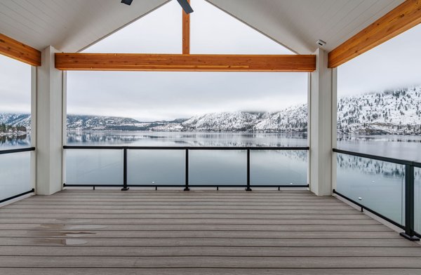 Lake Side Getaway - Custom Lake Chelan residence makes the best of a steep lot on the waterfront. 

Open floor plans and big sliders opening to a deck on both levels, looking out over the water. 

Classic finishes and resilient flooring make for a timeless lake house look.