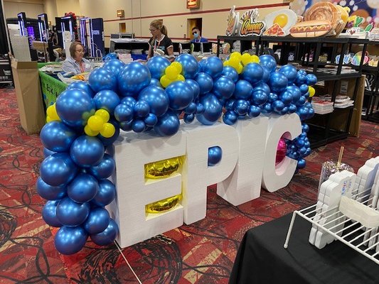 Photobooth Expo EPIC Balloon Display - The Photobooth Expo is the largest conference for photobooth owners.  EPIC Print Concepts asked me to create a balloon entry way to draw attention to their space and welcome guests in.  For this display we used marque letters and balloons that matched their brand colors.