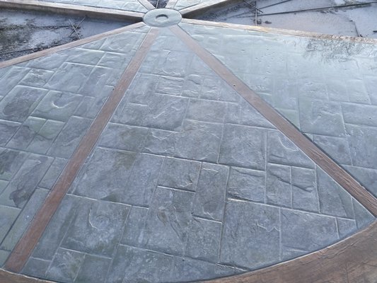 20’ Stamped concrete wagon wheel - 20 ft 6 color Stamped concrete wagon wheel. Wood grain stamp to represent the wood in the wagon wheel Black center around 3” Brass to represent the inner bearing and steel hub found on old wagon wheels. Black outer ring representing the steel tread that was used on steel wagon wheels. Then the ashlar slate tile stamp 3 color to match the surrounding driveway. 20’ Stamped concrete wagon wheel - 20 ft 6 color Stamped concrete wagon wheel. Wood grain stamp to represent the wood in the wagon wheel Black center around 3” Brass to represent the inner bearing and steel hub found on old wagon wheels. Black outer ring representing the steel tread that was used on steel wagon wheels. Then the ashlar slate tile stamp 3 color to match the surrounding driveway.