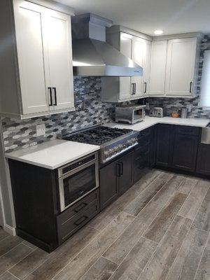 ✨ STUNNING ✨ Kitchen Remodel - This beautiful kitchen remodel in Falmouth was completed this week. The remodel features pewter gray Thomasville Cabinetry Canada cabinets, ceramic tile backsplash, white Silestone by Cosentino tabletop, a stainless steel farmhouse sink, stainless steel appliances, a double wall oven and vented hood above a gas cooktop.
Along with the kitchen you'll see a full bath remodel and complete 1st floor ceramic plank flooring. ✨ STUNNING ✨ Kitchen Remodel - This beautiful kitchen remodel in Falmouth was completed this week. The remodel features pewter gray Thomasville Cabinetry Canada cabinets, ceramic tile backsplash, white Silestone by Cosentino tabletop, a stainless steel farmhouse sink, stainless steel appliances, a double wall oven and vented hood above a gas cooktop.
Along with the kitchen you'll see a full bath remodel and complete 1st floor ceramic plank flooring.
