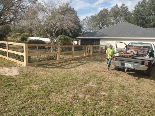 Field Fence project in Mt. Dora - This is a 3 board field fence. We added no climb wire to the front and welded wire to the sides and back. We also built a custom gate based on the customers design. Field Fence project in Mt. Dora - This is a 3 board field fence. We added no climb wire to the front and welded wire to the sides and back. We also built a custom gate based on the customers design.