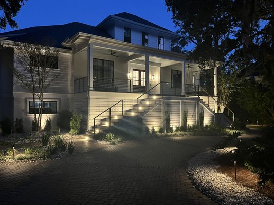 Outdoor Lighting Services - Stunning, right? Elegant outdoor lighting does more than just illuminate—it completely transforms your home’s architectural beauty and curb appeal after the sun goes down. At Ecologic Outdoor Lighting, we design custom setups that make magic happen after dark. Let’s bring your home to life!