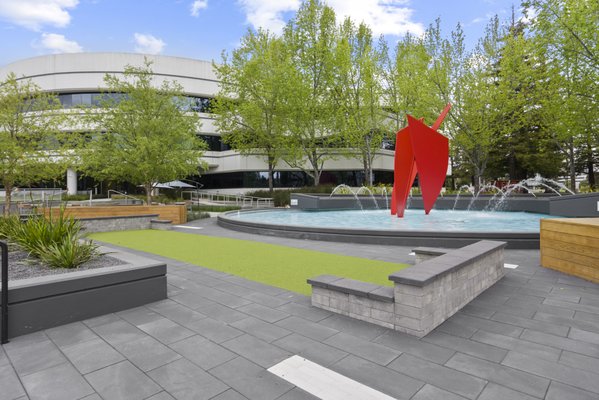 Commercial Landscape Design and Installation Featuring Walkway Pavers - This commercial project included the installation of artificial turf, a putting green, and paver walkways throughout the plaza. A retaining wall was also added to define activity zones and provide integrated seating within the area. Completed in San Mateo, CA (94404). Commercial Landscape Design and Installation Featuring Walkway Pavers - This commercial project included the installation of artificial turf, a putting green, and paver walkways throughout the plaza. A retaining wall was also added to define activity zones and provide integrated seating within the area. Completed in San Mateo, CA (94404).