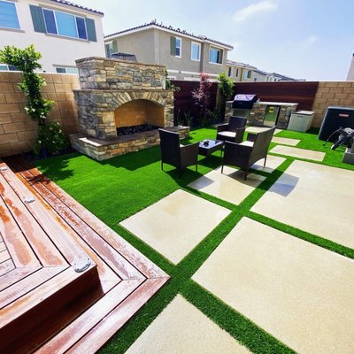 Modern Entertainment Backyard - This backyard was very small and we found a perfect layout for this project with very minimal maintenance. We leveled the area and installed artificial grass, Sand Finished Concrete, beautiful outdoor kitchen with a huge fireplace and more Modern Entertainment Backyard - This backyard was very small and we found a perfect layout for this project with very minimal maintenance. We leveled the area and installed artificial grass, Sand Finished Concrete, beautiful outdoor kitchen with a huge fireplace and more