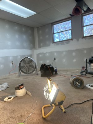 Basement room remodel - This room was outdated. Paneling replaced with drywall. Recessed lights put in. New drop ceiling installed. Carpet removed. Laminate pergo floor installed. New closet and bedroom door.