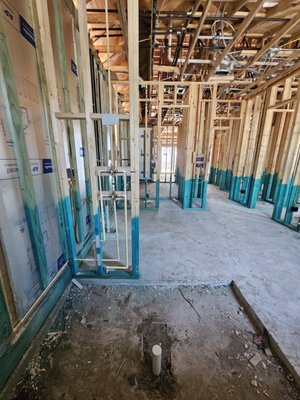New Construction - We offer comprehensive new construction plumbing services, specializing in custom and semi-custom homes. Our services include design assistance, groundwork installation, and pressure testing.