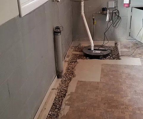 waterproofing and sump pumps - I got a call from a customer if i had any experience on doing waterproofings and i told him yes so we jackhammered hes basement and and opened up a trench out around the whole perimeter of hes basement then we installed system in hes trench to guide the water into the sump pump that we installed as part of the service then when the basin fills with water the sump pump kicks on and immidiately and pumps the water out of the basement into the downspouts lines and away from your foundation we dont ever garantee that water will never get in your foundation our job is to keep your basement dry and redirect water away from your foundation so you as the customer have peace of mind. waterproofing and sump pumps - I got a call from a customer if i had any experience on doing waterproofings and i told him yes so we jackhammered hes basement and and opened up a trench out around the whole perimeter of hes basement then we installed system in hes trench to guide the water into the sump pump that we installed as part of the service then when the basin fills with water the sump pump kicks on and immidiately and pumps the water out of the basement into the downspouts lines and away from your foundation we dont ever garantee that water will never get in your foundation our job is to keep your basement dry and redirect water away from your foundation so you as the customer have peace of mind.
