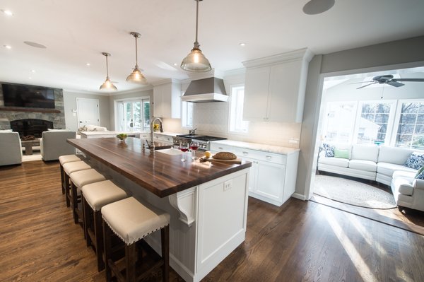 Christiana Traditional - A wonderful traditional kitchen done by our Designer Karen Hourigan displaying mixed materials of wood island counter top with farmhouse sink base and on the range wall a stainless hood combined with wood moldings to create a unique look. White painted full over lay cabinets provided by one of our 5 cabinet lines we offer. Christiana Traditional - A wonderful traditional kitchen done by our Designer Karen Hourigan displaying mixed materials of wood island counter top with farmhouse sink base and on the range wall a stainless hood combined with wood moldings to create a unique look. White painted full over lay cabinets provided by one of our 5 cabinet lines we offer.