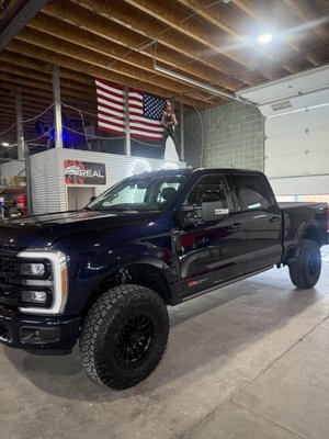 2023 Ford F-250 Tremor - The owner of this ford wanted a show quality paint finish and Top Tier Ceramic Coating. We started this vehicle off with a 5000 grit wet sand to remove any scratches and swirls, followed up by a full rotary cut to remove any scratches left from sanding, then we did a 2 step polish to remove any rotary marks, bring out the true potential of the paint and give it that mirrored image. The truck was then topped off with a 6+ year ceramic coating from CCI to keep it protected, looking as good as it left our shop, and easy to wash. We also did a full interior detail and coated all the glass with a CCI Glass coating. 2023 Ford F-250 Tremor - The owner of this ford wanted a show quality paint finish and Top Tier Ceramic Coating. We started this vehicle off with a 5000 grit wet sand to remove any scratches and swirls, followed up by a full rotary cut to remove any scratches left from sanding, then we did a 2 step polish to remove any rotary marks, bring out the true potential of the paint and give it that mirrored image. The truck was then topped off with a 6+ year ceramic coating from CCI to keep it protected, looking as good as it left our shop, and easy to wash. We also did a full interior detail and coated all the glass with a CCI Glass coating.