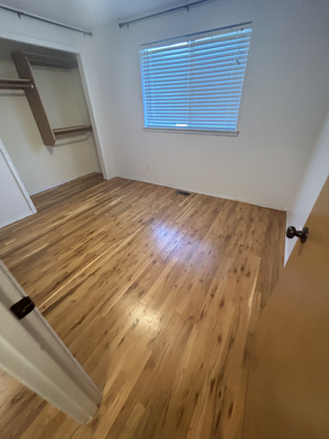 Refinished Floor - Refinishing a wood floor starts with coarse grit sanding, removing old finish. Progress to medium grit for smoothing, then fine grit for a flawless surface. Edges and corners are addressed, always sanding with the grain. Proper dust removal is vital for a clean base before applying a new finish. After a gloss refinish, the wood floor radiates a luxurious sheen. The high gloss enhances the natural beauty, creating a lustrous and durable surface. It not only reflects light beautifully but also adds a touch of sophistication to the space. The result is a polished and timeless floor that not only stands out but also stands the test of time, showcasing the craftsmanship and attention to detail invested in the refinishing process. Refinished Floor - Refinishing a wood floor starts with coarse grit sanding, removing old finish. Progress to medium grit for smoothing, then fine grit for a flawless surface. Edges and corners are addressed, always sanding with the grain. Proper dust removal is vital for a clean base before applying a new finish. After a gloss refinish, the wood floor radiates a luxurious sheen. The high gloss enhances the natural beauty, creating a lustrous and durable surface. It not only reflects light beautifully but also adds a touch of sophistication to the space. The result is a polished and timeless floor that not only stands out but also stands the test of time, showcasing the craftsmanship and attention to detail invested in the refinishing process.