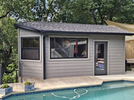 Siding Replacement - We recently gave this Austin, TX pool cabana a full upgrade—replacing the siding with durable James Hardie® fiber cement board and finishing it off with Sherwin-Williams SuperPaint in the sleek color Gauntlet Gray.