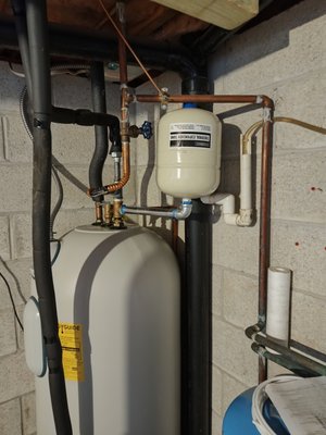 Leaking water heater - This was an existing water heater that had been improperly installed without a proper expansion tank. With only a thermal expansion fitting the system was over pressurized creating a leak at the fitting and a high possibility for the pressure relief valve to open and cause flooding and damage to the water heater and area around it. If you see water on your floor around the water heater and cannot locate a leak It is usually caused by the lack of a water heater expansion tank. Expansion tanks are vital to prevent the overpressurization of your plumbing water piping.