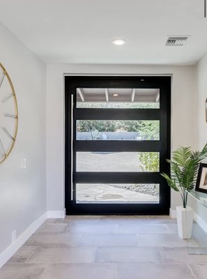 Custom Doors - Elevate the look of your home with a stunning entry pivot door or a custom glass door.