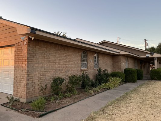 Power wash + Exterior paint in Lawton - After 30 years of no change, this house was power washed and spray painted. The contrasting colors enhanced the size of the home and made it look more modern.