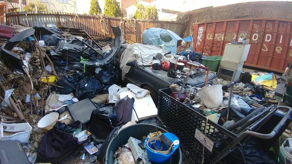 Commercial Yard Cleanout - If pictures can talk! This yard was a nightmare! There were people who happen to be living in the vehicles and they were using buckets for their waste. In the backyard, there were about 80 buckets of human waste that had to be disposed of! Sadly, they were using this yard as a dump. There were bags of debris, bricks, you name it, it was there! We removed over 24 Tons of garbage. This job took us 2 days to complete and unfortunately, we didn’t get to take the last photo after the power wash.