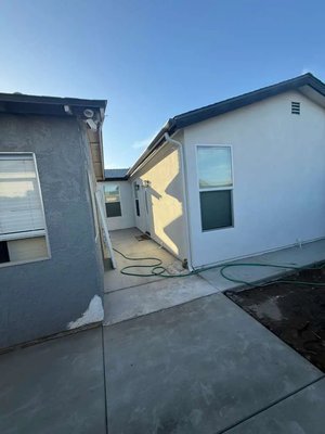 900 Sq. Ft. Detached ADU l - 09.22.25 - ZIP: 92126 - This 900 sq. ft., two-bedroom detached ADU in San Diego was built from the ground up. The gallery follows the work from the existing backyard and demolition through excavation, foundation, framing, roofing, plumbing, electrical, insulation, drywall, and finishes. The finished spaces include a full kitchen with light cabinetry and stainless steel appliances, two bedrooms, and a bathroom with a glass-enclosed shower. Exterior stucco and concrete paths complete the project story, while progress photos show the work behind the finished spaces. 900 Sq. Ft. Detached ADU l - 09.22.25 - ZIP: 92126 - This 900 sq. ft., two-bedroom detached ADU in San Diego was built from the ground up. The gallery follows the work from the existing backyard and demolition through excavation, foundation, framing, roofing, plumbing, electrical, insulation, drywall, and finishes. The finished spaces include a full kitchen with light cabinetry and stainless steel appliances, two bedrooms, and a bathroom with a glass-enclosed shower. Exterior stucco and concrete paths complete the project story, while progress photos show the work behind the finished spaces.