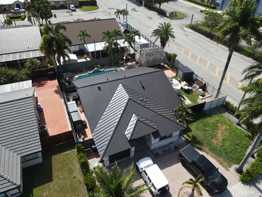 Miami Metal Roof - Dark Bronze - Completed a metal roof replacement in Miami, FL, featuring a durable standing seam roofing system built for long-term protection and Florida weather. Vice Roofing provides professional roof replacement, roof repair, and metal roofing services throughout Miami-Dade and Broward Counties Miami Metal Roof - Dark Bronze - Completed a metal roof replacement in Miami, FL, featuring a durable standing seam roofing system built for long-term protection and Florida weather. Vice Roofing provides professional roof replacement, roof repair, and metal roofing services throughout Miami-Dade and Broward Counties