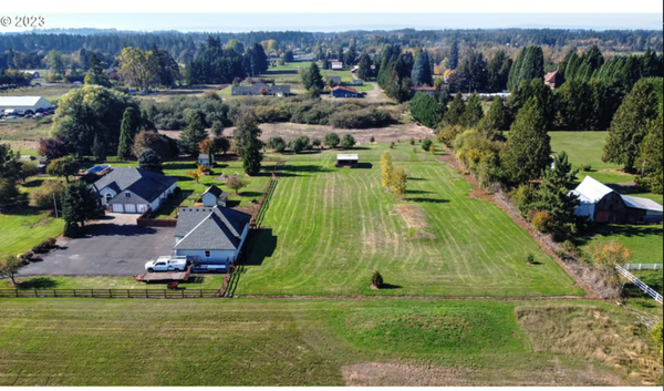17606 NE 77TH AVE, Battle Ground, WA - One of a kind custom home and custom shop. This beautiful property is located 3 minutes to I-5 and 5 mins to Costco. Beautiful private gated location. Manicured 5 acres with 17 fruit tree orchard. Tranquil backyard with covered patio with waterfall into the pond with lily pads and goldfish. Pool with deck to enjoy the summer. Chicken coop ready for your flock. Large pasture, cross fenced for animals with an animal shed. Fenced dog run next to the garage. WOW what a shop. This 4 bay shop is ready to GO! That is a total of 11 garage parking spots. Air lines with paint spray set-up, and 6 220 outlets run throughout the building. There are 3 heaters with thermostats to work and play through the winter. Wired for car lift. Built in shelves, pegboard, and work benches. Large paved parking area for as many vehicles as you need. This property as it all! Enjoy the kitchen and dining area as you overlook the pond. Great for entertaining!