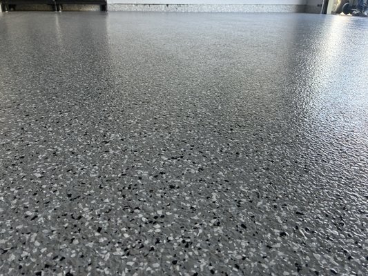 Tile removal to cleanable floor in just one day. - Customer was having trouble getting his tile off. Got about a quarter of it off gave us a call. We removed it Grind it down and laid a thick coat of epoxy with flake and added a poly aspartic clearcoat to protect it from yellowing. Now he has a nonslip surface. Tile removal to cleanable floor in just one day. - Customer was having trouble getting his tile off. Got about a quarter of it off gave us a call. We removed it Grind it down and laid a thick coat of epoxy with flake and added a poly aspartic clearcoat to protect it from yellowing. Now he has a nonslip surface.