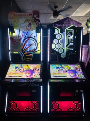 Rhythm Game Arcade Line Up - We have a fantastic selection of rhythm games. From fan favorites like Jubeat, dance games like StepManiaX, to the ever challenging Beatmania IIDX. There's always a new game to try out and master! Rhythm Game Arcade Line Up - We have a fantastic selection of rhythm games. From fan favorites like Jubeat, dance games like StepManiaX, to the ever challenging Beatmania IIDX. There's always a new game to try out and master!